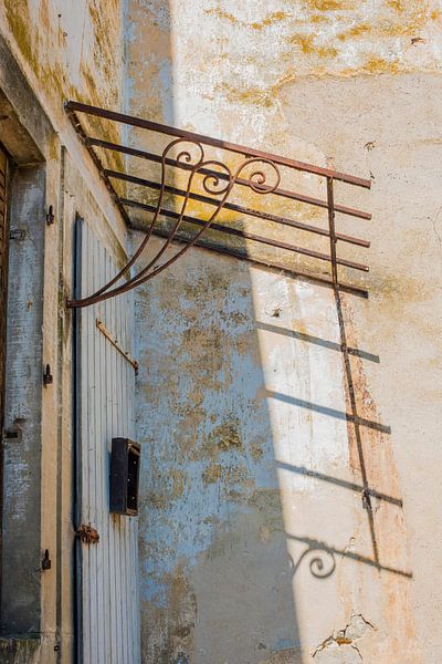 Shadow against yellow weathered wall by Blond Beeld