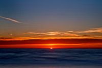 Zon onder in de Noordzee.