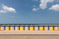 Row of brightly coloured beach huts in northern France