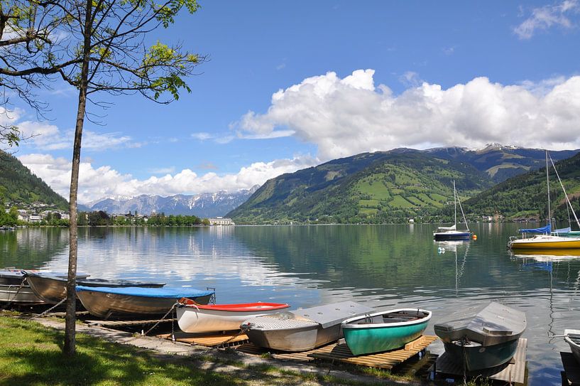 colourful boats in a lake in Austria by Lucie Lindeman