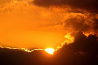 Behind the clouds the sun shines