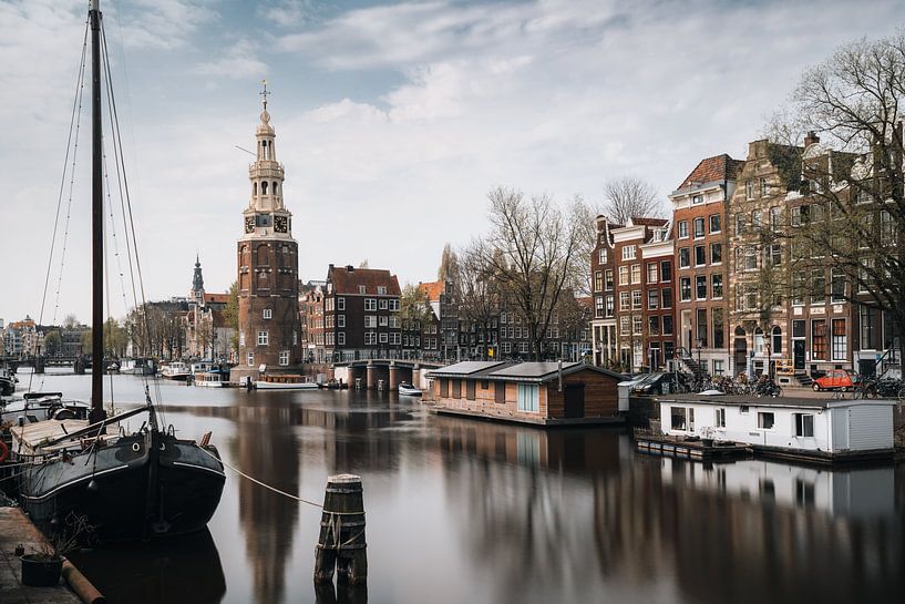 Montelbaan tower, canal and old houses in Amsterdam, the Netherlands. by Lorena Cirstea
