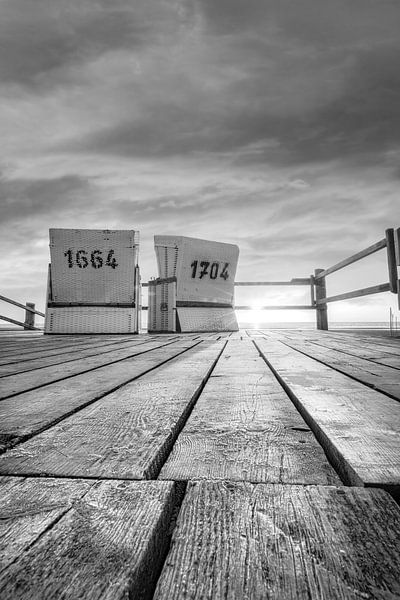 Beach chairs by the sea at sunset in black and white . by Manfred Voss, Black-White Photography
