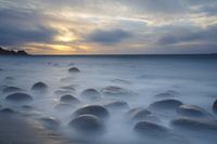 Floating stones on the beach (Lofoten, Norway)