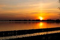 Red sunset by the water