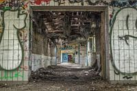 Urbex corridor with lots of graffiti