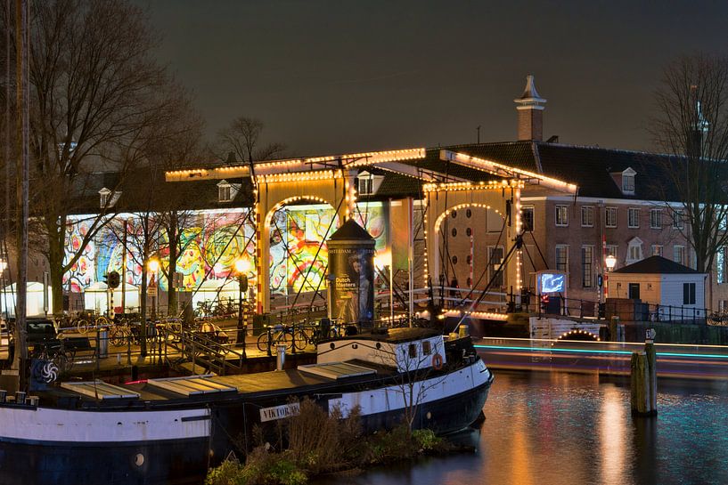 Illuminated wooden bridge in Amsterdam by Peter Bartelings