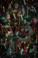 Beautiful antique baubles and candles in a unique crib setting with a homely atmosphere.