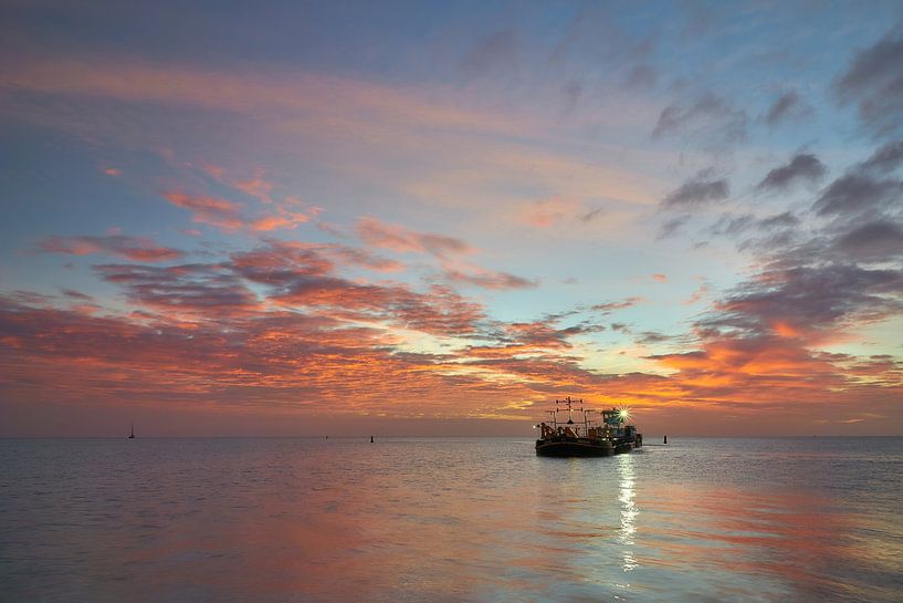 Dredger at Oudeschild Texel harbor during sunrise by Ad Jekel