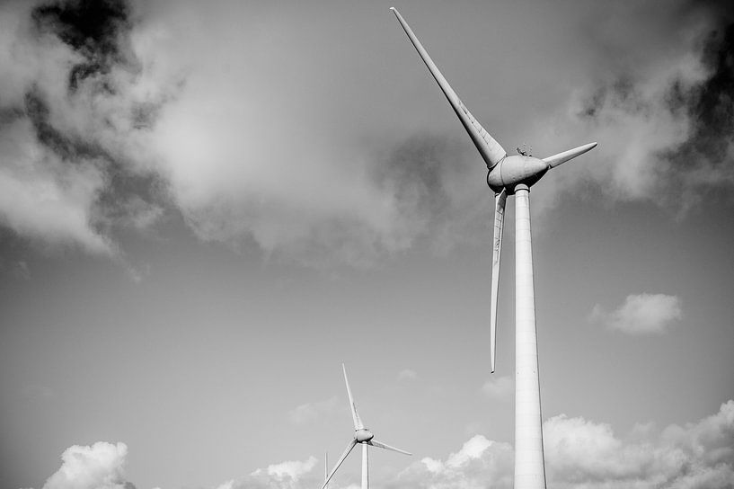 Wind turbines with a blue sky and clouds in the background by Sjoerd van der Wal Photography