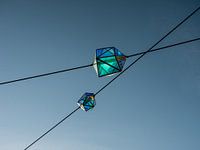 Modern blue lanterns from glass in the sky