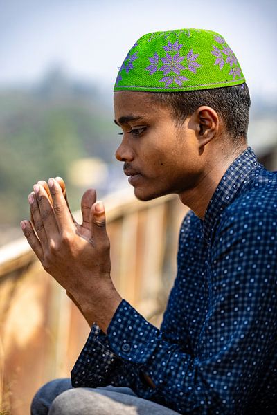 A young Islamic Muslim Boy during prayer by Steven World Traveller