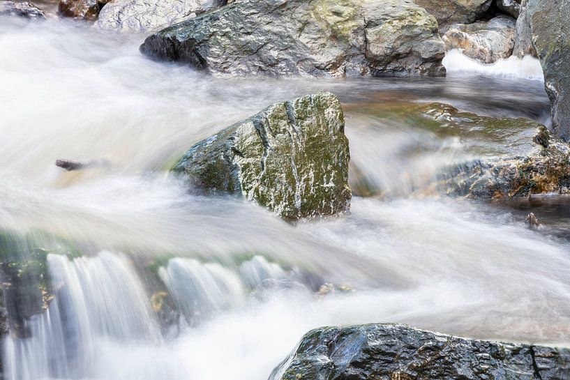 Stone in wild river by Andrew van der Beek