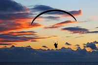 Paraglider by sunset