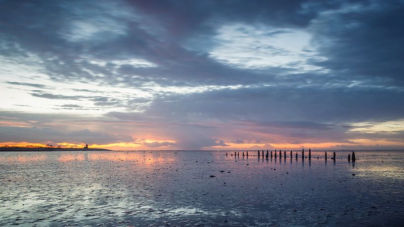 After rain comes..... Sunset Wierum Wadden Sea by Martijn van Dellen