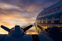 DC-3 under a beautiful cloud sky during sunrise