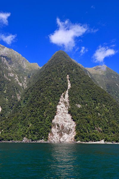 Reflections from the mountain in Milford Sound by Be More Outdoor