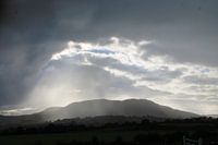 Breaking open cloud cover over the mountains Ireland