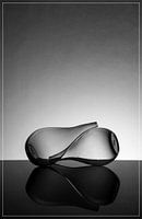 Two tapered vases against each other on a high-gloss background.