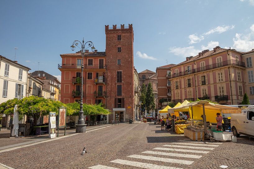 Square with tower and market in the centre of Asti, Piemont, Italy by Joost Adriaanse