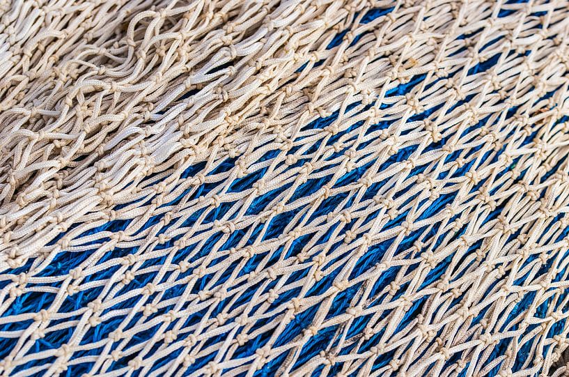 Close-up of maritime gray and blue fish net pattern texture by Alex Winter