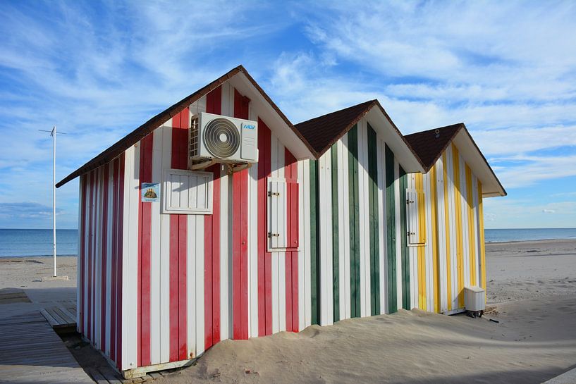 Red, green, yellow striped beach houses on the Spanish Costa by My Footprints