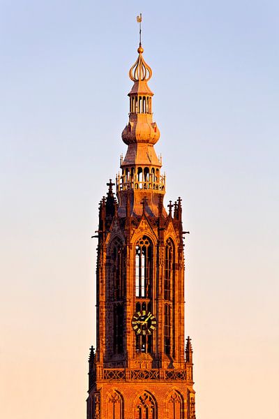 Top of the Onze lieve Vrouwetoren in Amersfoort during sunset by Anton de Zeeuw