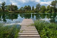 A view of a lake with a jetty near Allstedt