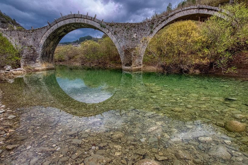 The old bridge of Plakida or Kalogeriko of Zagori at the region of Ioannina in Epirus Greece by Konstantinos Lagos