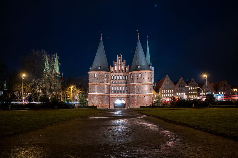 Holsten Gate in Lübeck by night by Animaflora PicsStock