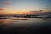 Zonsondergang aan zee