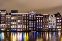 Amsterdamse Damrak in de Avond