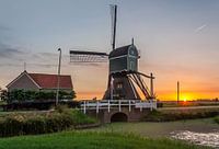 Zonsondergang over de polder