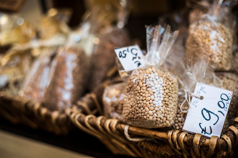 Bags of lentils at a food market in Calabria by Manja Herrebrugh - Outdoor by Manja