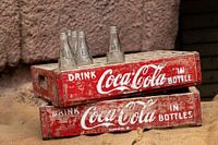Vintage Cola crates with coca cola bottles.