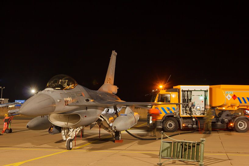 An F-16 is refueled for a night flight by Arjan van de Logt