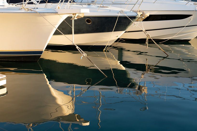 Boats and their reflection in the evening light by Adriana Mueller