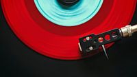 Red vinyl singe on record player