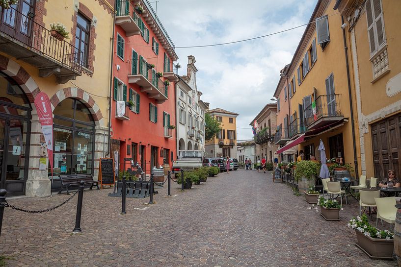 Shopping street in Piedmont, Italy by Joost Adriaanse