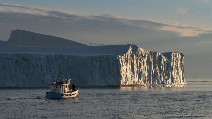 Fishing boat in the evening sun in Greenland by Anges van der Logt
