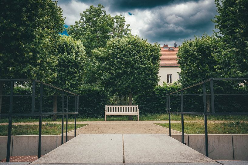 Bench in front of trees by Holger W. Spieker
