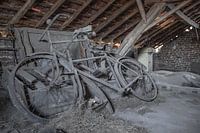 Old bicycles in dilapidated attic