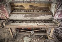 Old piano in an abandoned hotel