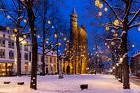 Our Lady Church in the blue hour with snow and Christmas lights