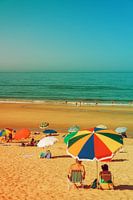 Costa da Caparica Beach, Portugal. Vibrant Beach Scene with Colorful Umbrellas and Relaxing Seaside Atmosphere