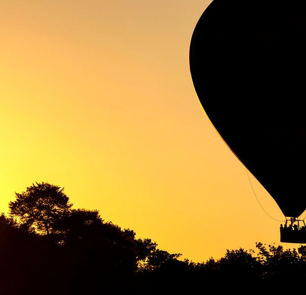 Air balloon at sunset by Marcel Kerdijk