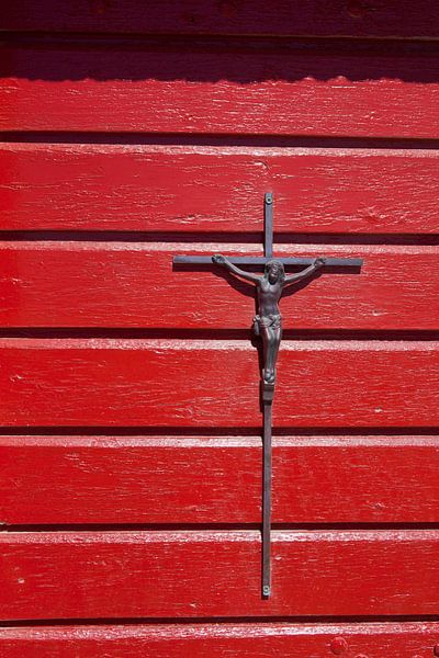 Crucifix on red background by Kees van Dun