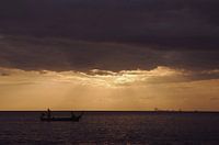 Sunset with fishing boat
