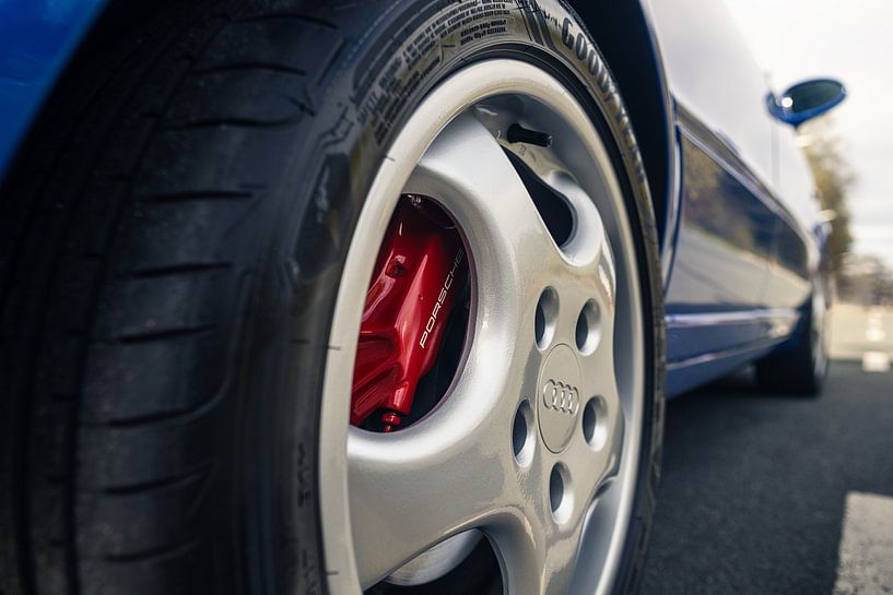 Blue Audi RS2 on Long Road by Historic Wall by Sebastiaan van 't Hoog
