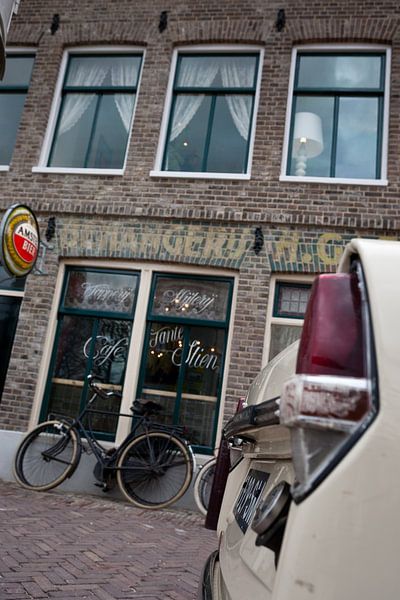 Old-fashioned café with bicycle and DAF by Arthur van Iterson